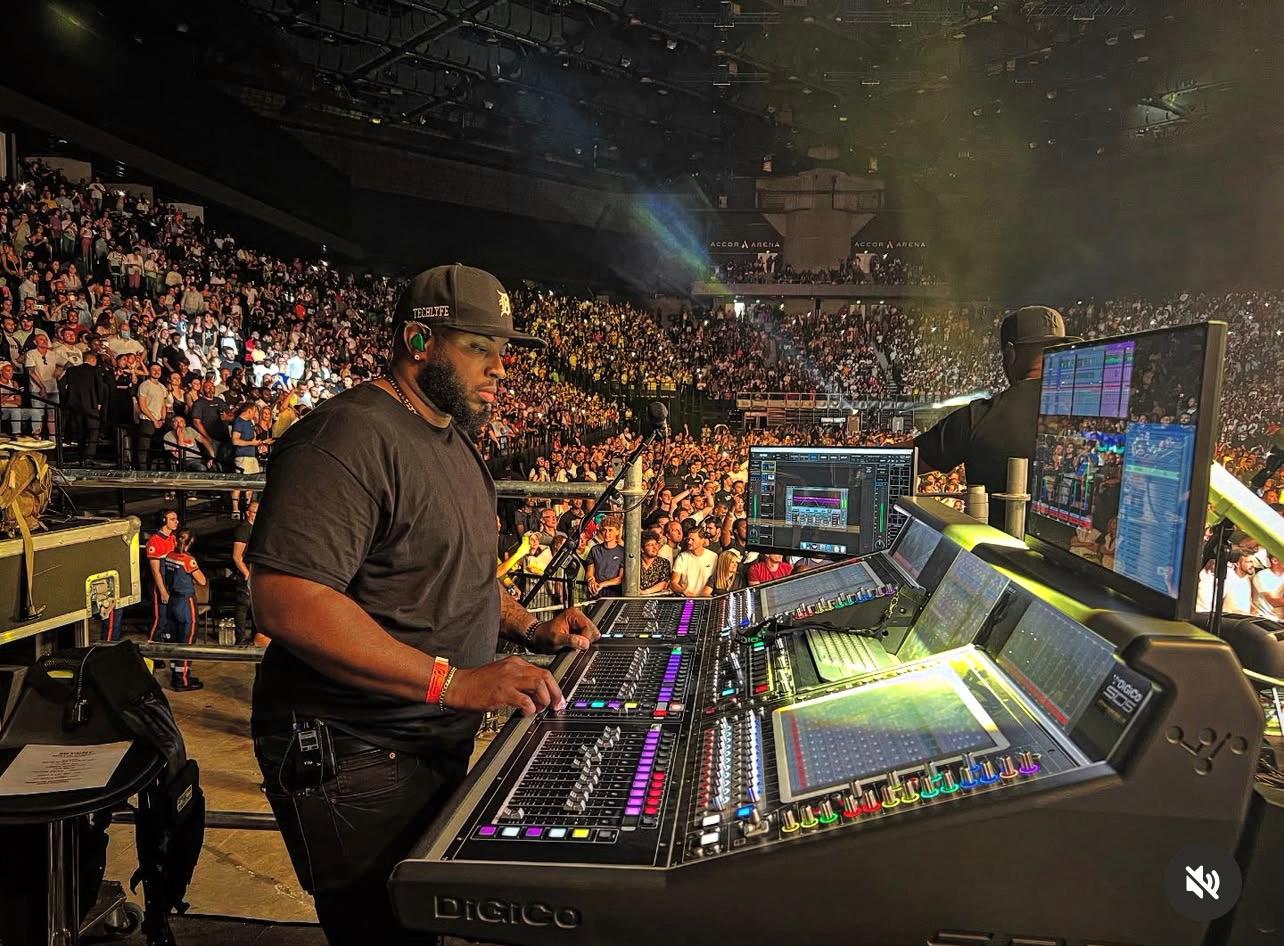 Audio engineer at mixing console