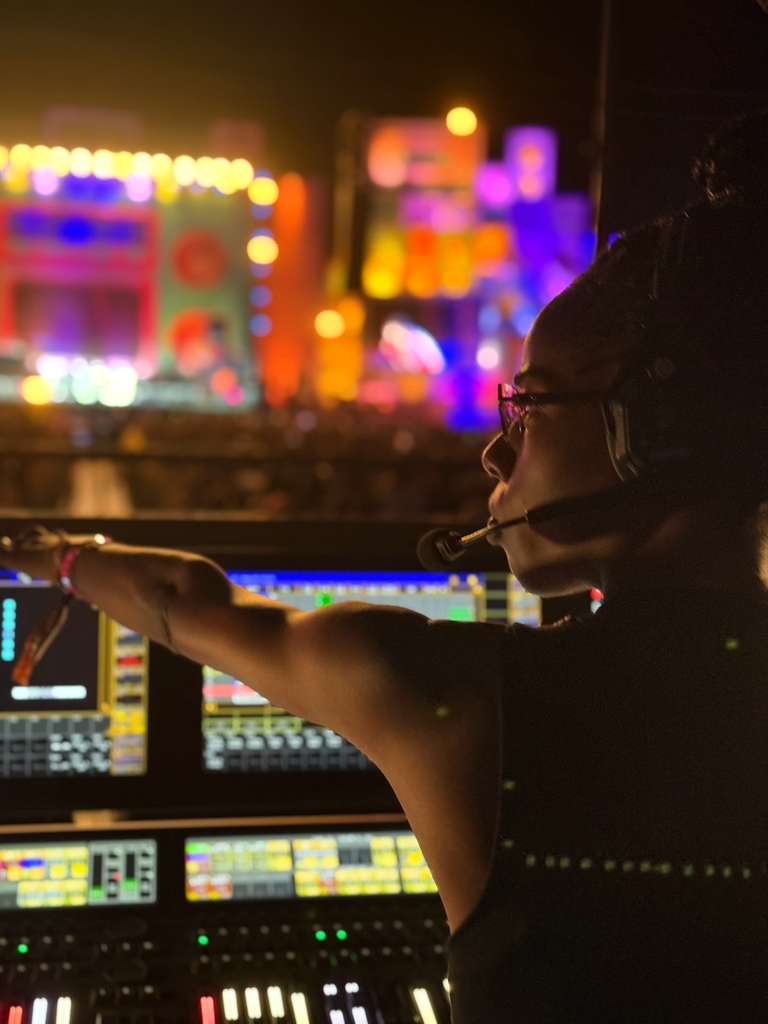 Erica pointing at colorful stage